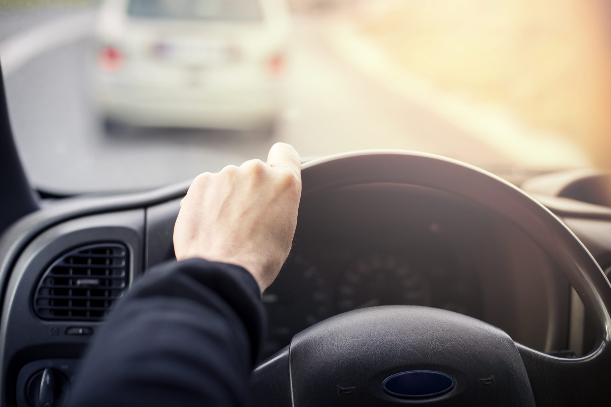 man driving car